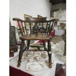 A 19th century smoker's bow arm chair