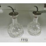 A pair of fine crystal perfume bottles w