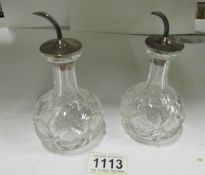 A pair of fine crystal perfume bottles w
