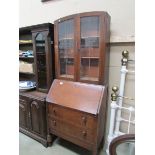 An oak bureau book case