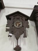 A Cuckoo clock with pendelum and weights