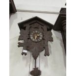 A Cuckoo clock with pendelum and weights