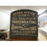 An advertising sign for a coal merchant