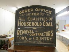 An advertising sign for a coal merchant