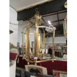 A large brass 'cage' lantern (Christophe