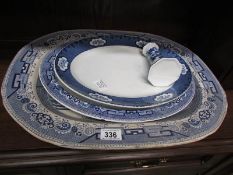 3 large blue and white platters and a va