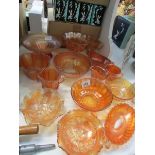 14 pieces of orange carnival glass