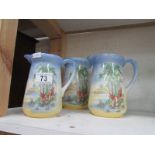 A set of 3 graduated jugs