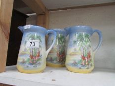 A set of 3 graduated jugs