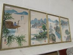 A set of 4 framed and glazed Oriental pa