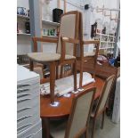 A teak dining table and 6 chairs by Morr