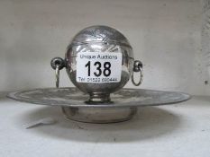 A silver plated inkwell