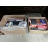 2 boxes of books and event newspapers