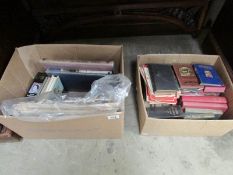 2 boxes of books and event newspapers
