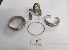 3 silver bangles and one other