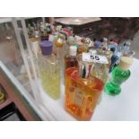 A large collection of vintage perfume bottles including Chanel, Givenchy etc