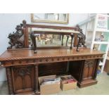 A Victorian carved oak double pedestal s