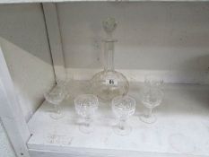 A glass decanter and 6 glasses