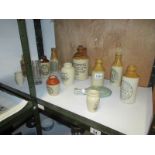 13 glass and stoneware jars, some advert