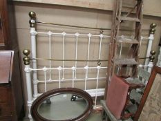 A 6ft brass and iron bedstead with slats