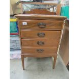 A mahogany 4 drawer music cabinet