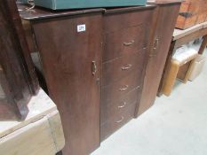 A 2 door, 5 drawer cabinet
