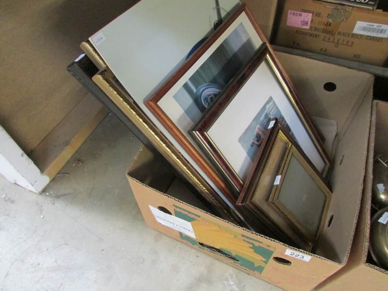 A box of prints and frames