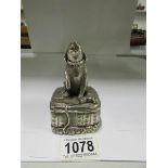 A silver 'filled' dog figurine signed F