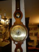 A Victorian inlaid barometer by E Gilber