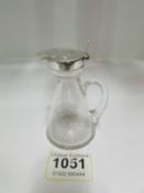 A small silver topped jug
