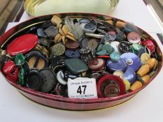 A tin of old buttons