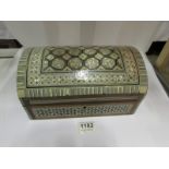 A large jewellery box with mother of pea