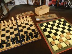 A chess set, draughts set and 2 cribbage