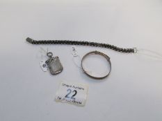 A silver baby bracelet, silver fob and w
