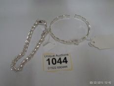 A silver link bracelet and bangle