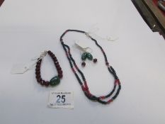 A necklace, bracelet and earrings