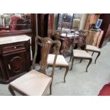 A set of 4 high back dining chairs