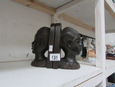 A pair of African heads as  bookends