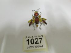 A jewelled insect brooch