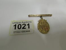 A 9ct gold locket brooch