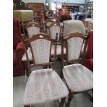 A set of 6 upholstered dining chairs