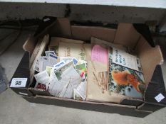 A box of cigarette cards, loose and in a