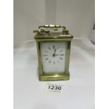 A brass carriage clock, glass a/f