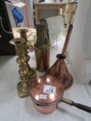 A pair of brass candlesticks, copper fun
