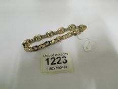 A gold bracelet, 15gms