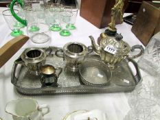 A silver plate tea set on tray