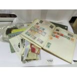 A mixed lot of stamps, post cards etc