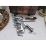 A chromed bar cork screw