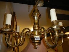 A heavy brass 5 lamp ceiling light