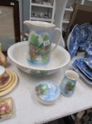 A cottage scene jug and basin set with s